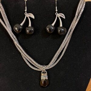 Black pendant necklace on triple silver tone chain with black cherry earring 14”